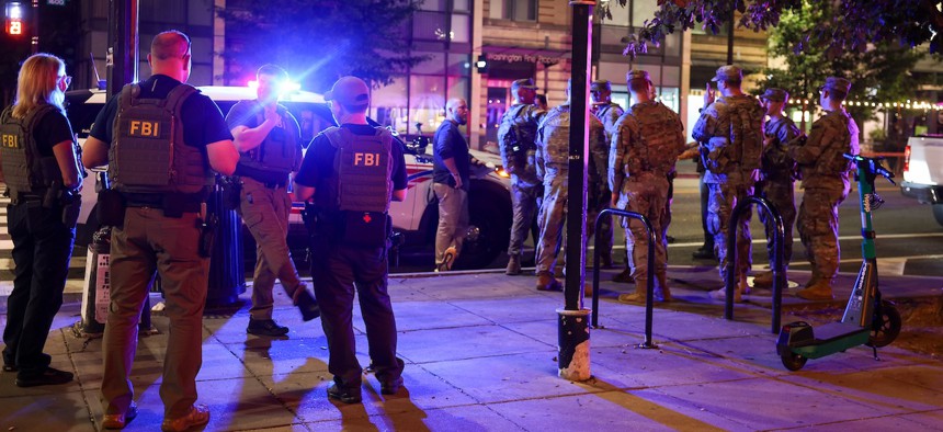 National Guard Members patrol 14th Street NW, working alongside D.C.’s Metropolitan Police Department and the FBI on Aug. 25, 2025. An increased presence of law enforcement has been seen throughout the nation's capital since President Trump ordered in federal officers and the National Guard.