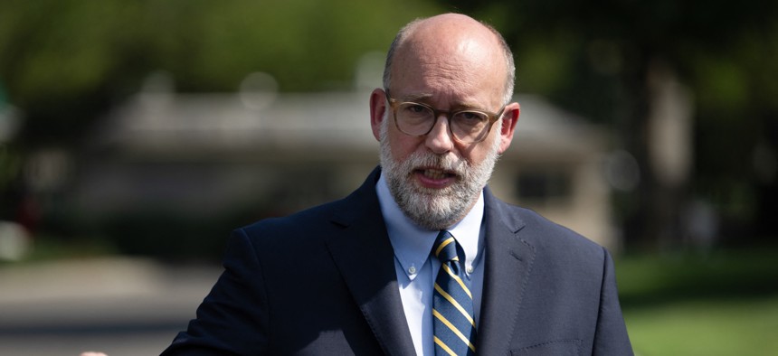 Office of Management and Budget Director Russ Vought speaks to reporters outside the West Wing of the White House on July 17, 2025. Vought will oversee the “closeout” of USAID after the president authorized a $4.9 billion pocket rescission of the agency's funding.