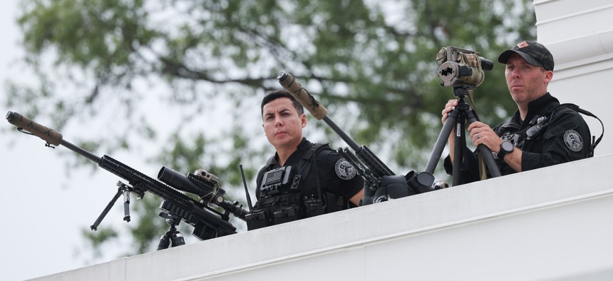 A U.S. Secret Service counter sniper team is shown on the roof of the West Wing of the White House as President Donald Trump tours the roof on Aug. 5, 2025.