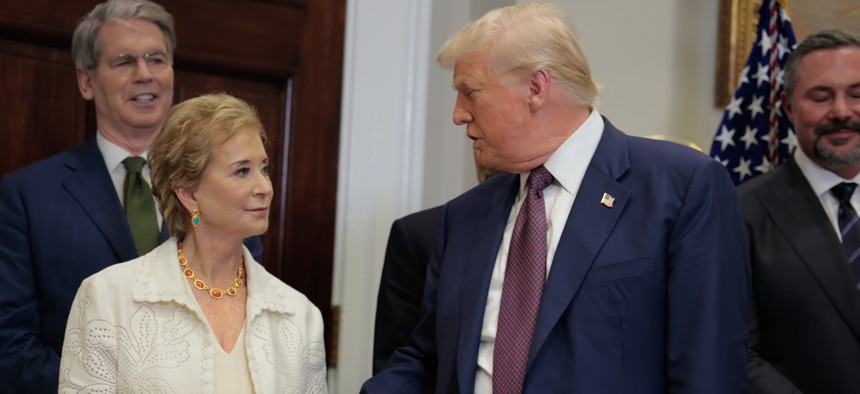 President Donald Trump speaks with Education Secretary Linda McMahon during an executive order signing ceremony in the Roosevelt Room of the White House on July 31, 2025. Trump has called for unwinding the department.