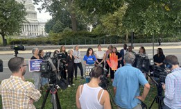 Helen Luryi, formerly of the Labor Department, wears a shirt that says "tenacious not traumatized," which is a reference to comments made by OMB Director Russell Vought, during a press conference near the U.S. Capitol.