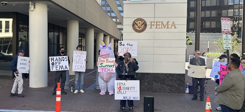 Protestors, including one dressed in an inflatable unicorn costume, gathered outside of the Federal Emergency Management Agency's Washington, D.C., headquarters on Friday.
