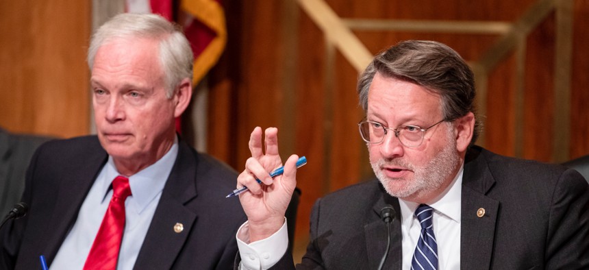 Sens. Ron Johnson, R-Wis., and Gary Peters, D-Mich., have signaled, along with Sen. Chris Van Hollen, D-Md., the possibility of a legislative compromise to pay federal employees, servicemembers and contractors during the shutdown.