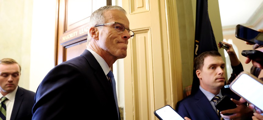 Senate Majority Leader John Thune, R-S.D. speaks to reporters as he walks to his office in the U.S. Capitol on Oct. 27, 2025 in Washington, D.C.