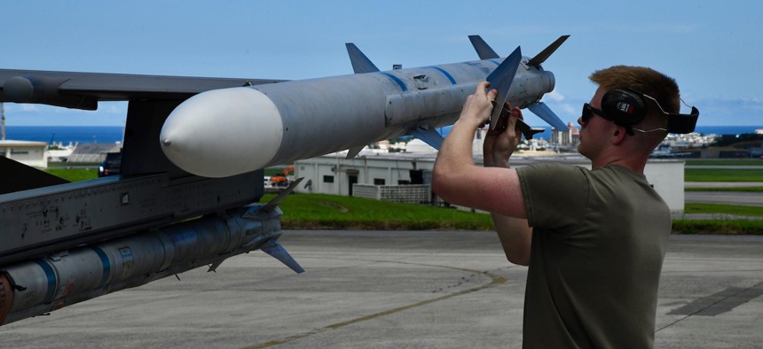A weapons load crew participates in the 18th Maintenance Group's 2nd quarter weapons load competition on July 19, 2024.