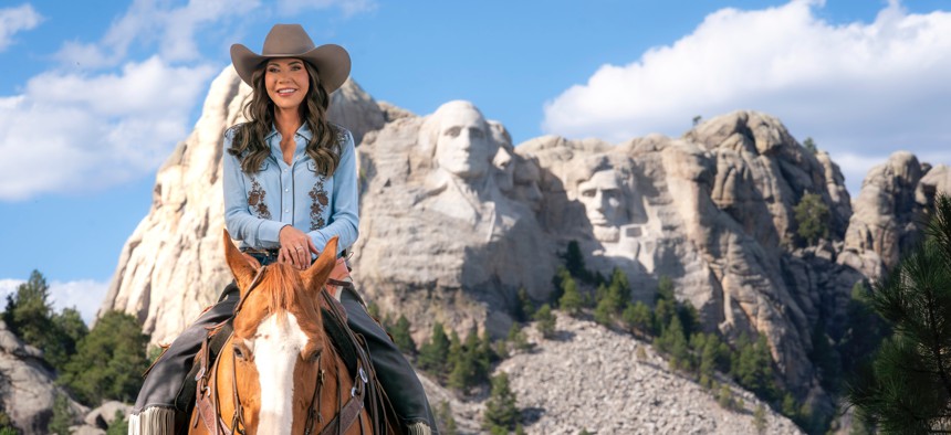 Homeland Security Secretary Kristi Noem rides a horse while filming an ad at Mount Rushmore National Memorial in South Dakota, Oct. 2, 2025.