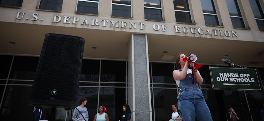 Student protestors shout during the "Hands Off Our Schools" rally on April 4, 2025 in front of the U.S. Department of Education in Washington, D.C. On Dec. 2, Dem lawmakers and a student coalition held a virtual press conference to voice opposition to the dismantling plan.
