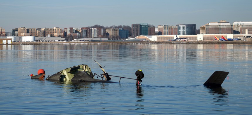 In this U.S. Coast Guard handout, the Coast Guard investigates aircraft wreckage on the Potomac River on January 30, 2025, in Washington, DC.