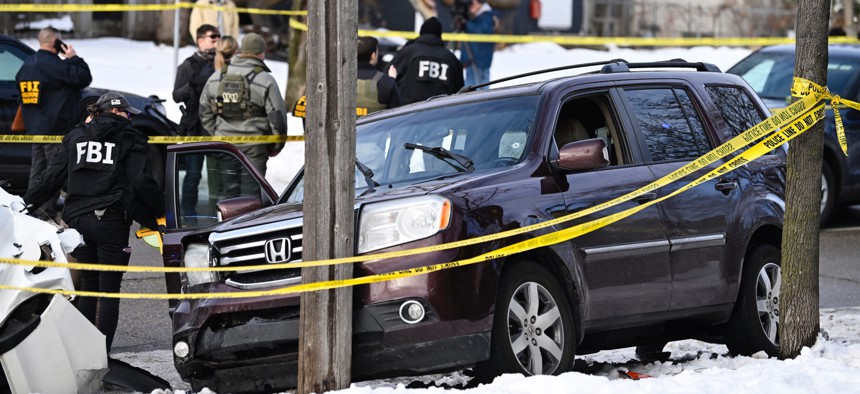 Members of law enforcement work the scene following a suspected shooting by an ICE agent during federal law enforcement operations on Jan. 7, 2026 in Minneapolis, Minnesota. According to federal officials, the agent, “fearing for his life” killed a woman during a confrontation in south Minneapolis. 