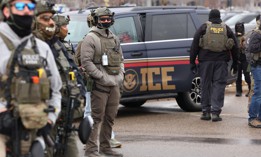 U.S. Homeland Security Investigations agents stand guard at the Bishop Henry Whipple Federal Building in Minneapolis, Minnesota, on Jan. 8, 2026, following a Jan. 7 shooting by an ICE agent that killed a Minneapolis woman.