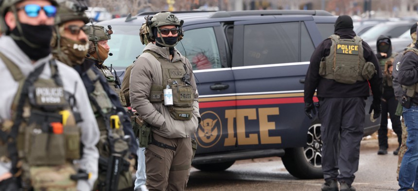 U.S. Homeland Security Investigations agents stand guard at the Bishop Henry Whipple Federal Building in Minneapolis, Minnesota, on Jan. 8, 2026, following a Jan. 7 shooting by an ICE agent that killed a Minneapolis woman.