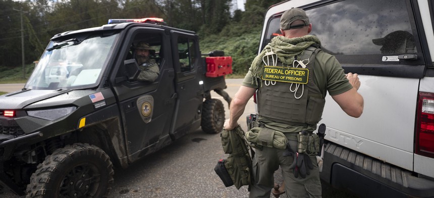 Chronic understaffing at federal prisons due to low pay and locations in often remote areas, led to overuse of mandatory overtime and temporarily detailing support staff to correctional duties, a phenomenon known as “augmentation.” 