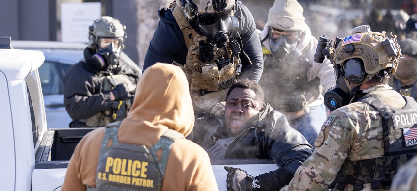 A protester in Minneapolis is arrested after Alex Pretti was fatally shot by federal agents in the area early on Jan. 24, 2026. Democrats withdrew their support for the “minibus” package after the fatal shooting on Saturday and have asked for the Homeland Security Department portion of it to be pulled out for separate negotiation. 