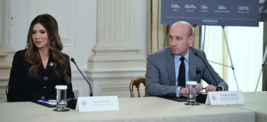 Homeland Security Secretary Kristi Noem and Homeland Security advisor Stephen Miller are seen during a roundtable event at the White House touting efforts on crime and immigration made by his administration on Oct. 23, 2025.