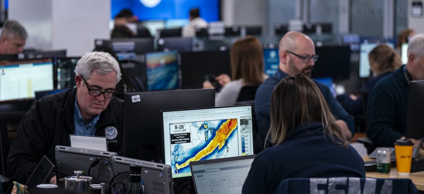 Employees in the National Response Coordination Center at the Federal Emergency Management Agency's headquarters on Jan. 24 in Washington, D.C. FEMA in January starting cutting contract employees. 