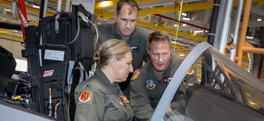 Members of the Michigan National Guard explore the cockpit of an F-15EX Eagle II aircraft at the Boeing production plant in St. Louis, Missouri, Nov. 13, 2025. 