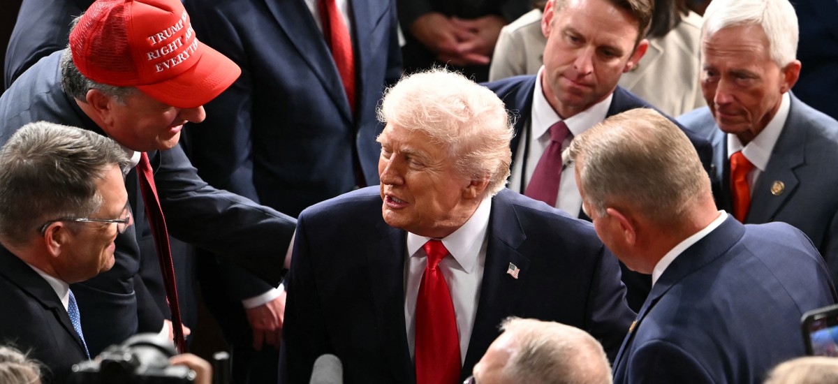 President Donald Trump shakes hands with members of Congress as he departs following his State of the Union address at the Capitol on Feb. 24.  