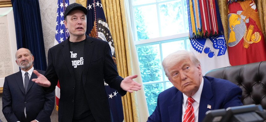 Elon Musk speaks alongside President Donald Trump to reporters in the Oval Office of the White House on May 30, 2025. Musk's deferred resignation program contributed to more than 134,000 resignations or retirements in the first have of 2025.