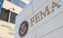 A discrepancy between the written testimony of the current official leading FEMA and the assertions of a DOJ attorney representing the disaster management agency has briefly halted court proceedings. 