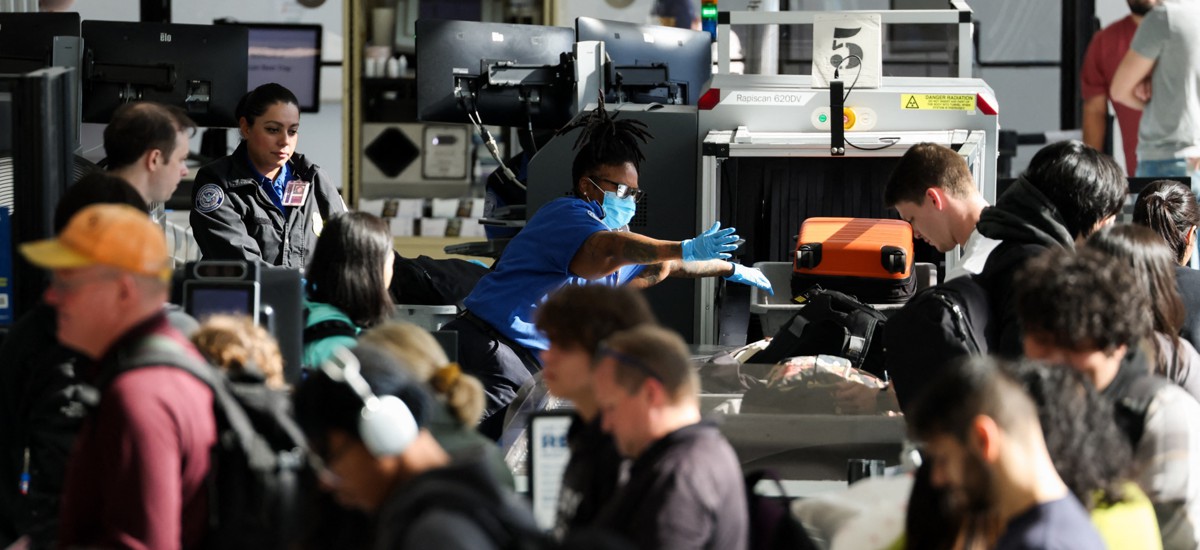 Passengers wait in line for a TSA security checkpoint while traveling at Los Angeles International Airport on Nov. 26, 2025. TSA workers could soon miss their first full paycheck due to the most recent partial government shutdown.
