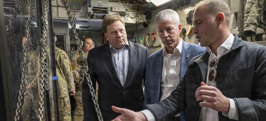 Defense Under Secretary for Acquisition and Sustainment Michael Duffey and Energy Secretary Chris Wright inspect a next-generation nuclear reactor during airlift by a C-17 to Hill Air Force Base, Utah, Feb. 15, 2026. 