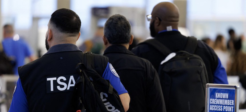 Transportation Security Administration agents arrive to work at William P. Hobby Airport in Houston on March 10, 2026. TSA officers are slated to miss their next paychecks because of the DHS shutdown.