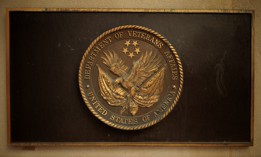 A plaque with the Department of Veterans Affairs' seal is displayed outside the VA headquarters on March 6, 2025.