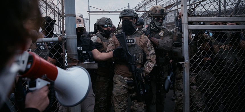 Federal agents stand guard during a protest against federal immigration enforcement raids at Delaney Hall Detention Facility on June 13, 2025 in Newark, N.J.