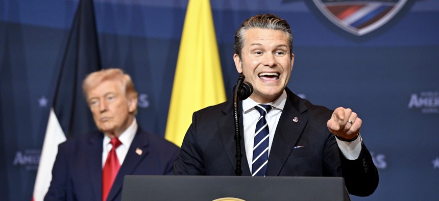 Defense Secretary Pete Hegseth speaks as President Donald Trump listens during the “The Shield of the Americas Summit,“ at the Trump National Doral Golf Club in Doral, Florida, on March 7, 2026.