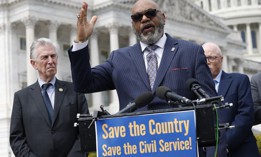 Everett Kelley (center), national president of the American Federation of Government Employees, warned that the move could portend Trump’s appointees to the authority putting their thumbs on the scale against unions.