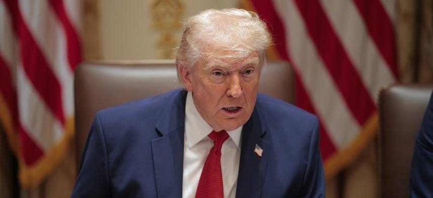 President Donald Trump speaks during a Cabinet meeting at the White House on March 26. The same day he signed an executive order dealing with diversity, equity and inclusion programs at federal contracting companies. 