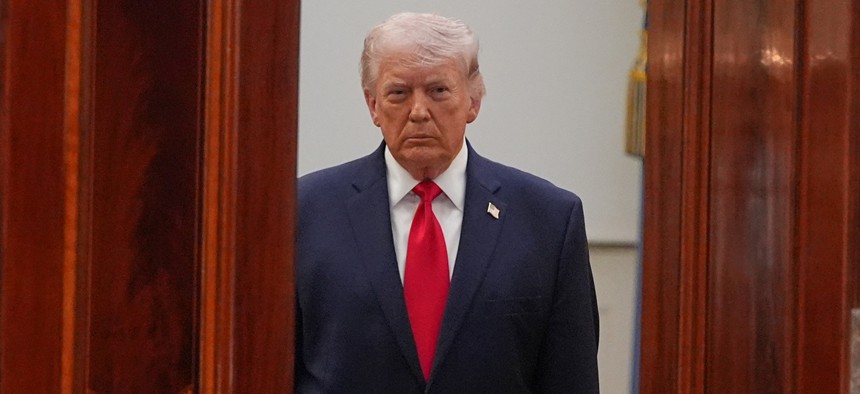President Donald Trump arrives to address the nation from the Cross Hall of the White House on April 1, 2026 in Washington, DC.