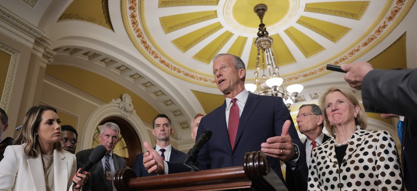 Senate Majority Leader John Thune, R-S.D., (center) speaks during a news conference following a weekly Republican policy luncheon at the U.S. Capitol on April 14, 2026. Thune said the Senate could vote as soon as next week on a budget resolution with reconciliation instructions.