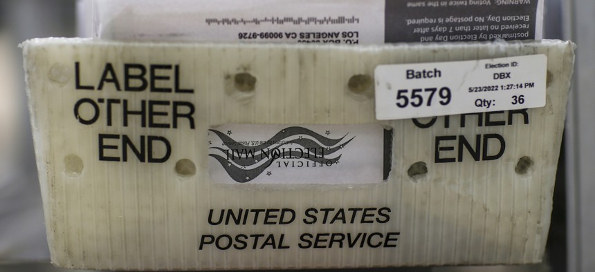 Mail-in ballots are processed at a facility where they are received from the post office, opened, sorted and verified then sent to be counted.