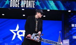 Elon Musk holds a chainsaw reading “Long live freedom, damn it” during the 2025 Conservative Political Action Conference. Musk took the helm of DOGE, the Trump administration’s Department of Government Efficiency, and oversaw cuts and reorganizations across federal agencies.