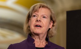 Sen. Tammy Baldwin, D-Wis., speaks at a press conference on Oct. 28, 2025. She said that senators "cannot allow the promotion of officers into the Coast Guard's senior ranks who have substantiated claims of retaliation in their records.”