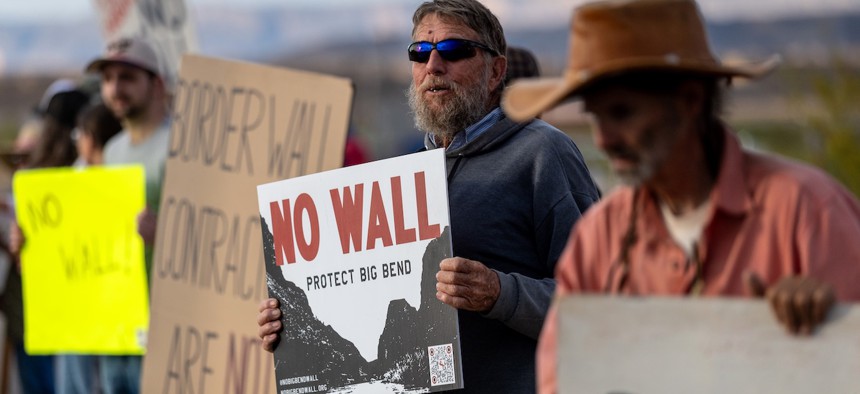 Local residents stage a weekly roadside protest against proposed border wall construction on April 11, 2026 in Terlingua, Texas. Trump Administration plans to extend the U.S.-Mexico border wall into the region sparked rare bipartisan unity among Texans against construction through one of the most rugged and pristine parts of the United States. Critics of the proposal say there is no need for a wall there, citing the low number of immigrants who attempt to cross through the area's forbidding terrain. 