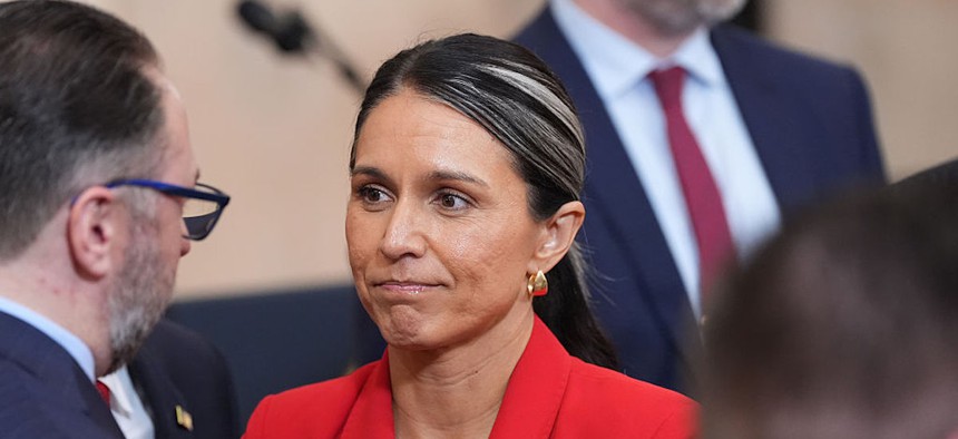 Director of National Intelligence Tulsi Gabbard stands after President Donald Trump spoke about the Iran war from the Cross Hall of the White House on April 1, 2026 in Washington, DC. 