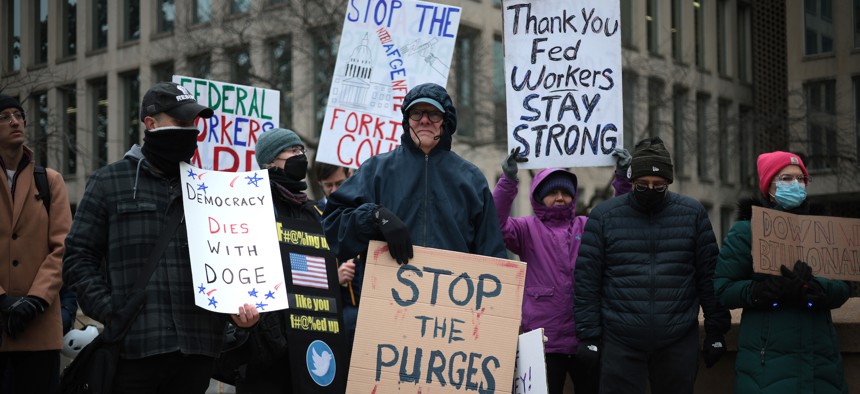 Protesters against the Department of Government Efficiency on Feb. 5, 2025, in Washington, D.C. DOGE pushed many civil servants out of government last year.