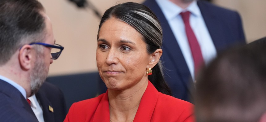Director of National Intelligence Tulsi Gabbard stands after President Donald Trump spoke about the Iran war from the Cross Hall of the White House on April 1, 2026 in Washington, DC.