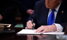 Trump signs order moving thousands of federal employees into Schedule F