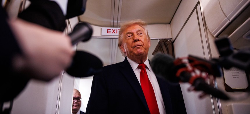 President Trump speaks with reporters while aboard Air Force One on June 5, 2026 en route to Chippewa Falls, Wis. Schedule Policy/Career is formerly known as Schedule F, and makes it easier to fire federal employees in “policy-related” jobs.