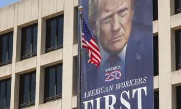 A banner with a portrait of President Donald Trump is displayed on the front of the Labor Department's Frances Perkins Building on May 30, 2026, in Washington, D.C. DOL saw a significant spike in its social media engagement between 2024 and 2025. 