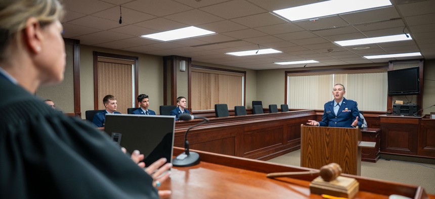A judge advocate speaks to a judge, July 3, 2025, at Malmstrom Air Force Base, Mont. Last year, about 600 JAGs were assigned to work for the Justice Department as immigration judges.
