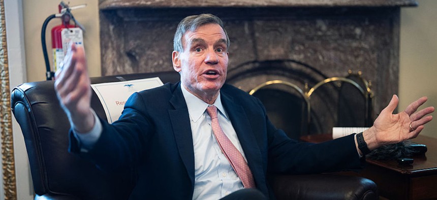 Sen. Mark Warner, D-Va., talks with reporters on "the narrow passage of Republicans' $70 billion immigration enforcement bill signed into law by President Trump," in the U.S. Capitol on June 11, 2026.