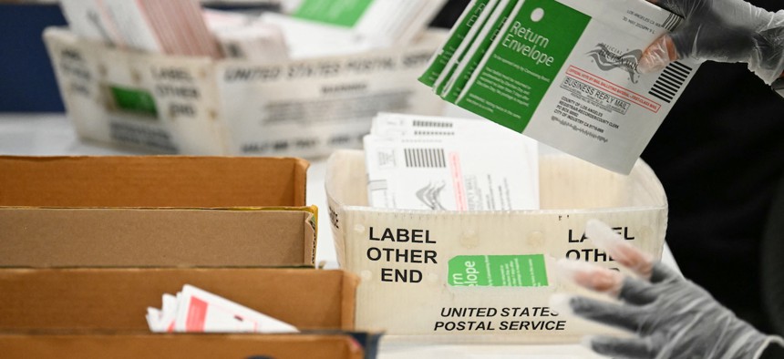 Election workers process mail-in ballots at the Los Angeles County Ballot Processing Center during California's state primary election in the City of Industry, Calif., on June 2, 2026.