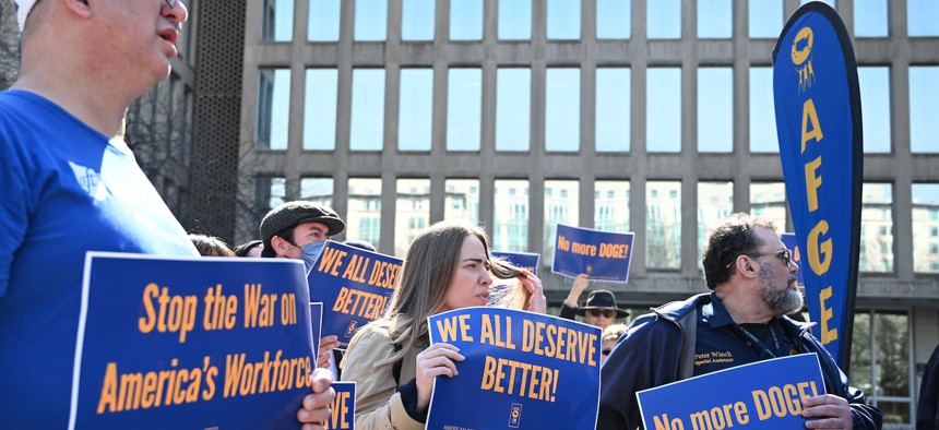 Protesters hold signs in solidarity with the American Federation of Government Employees of District 14 at a rally in support of federal workers at the Office of Personnel Management in Washington, D.C., March 4, 2025. AFGE warned that the NDA could also infringe on labor officials’ and members’ rights and duties under federal sector labor law.