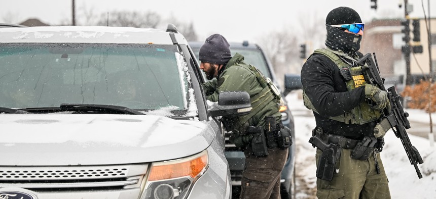 Border Patrol agents conduct a traffic stop on Jan. 21, 2026 in Minneapolis.