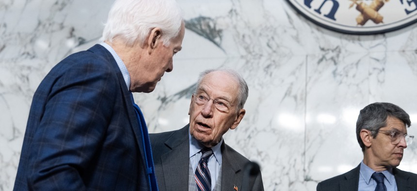 Sen. John Cornyn, R-Texas (left) and Chairman Chuck Grassley, R-Iowa, arrive for a Senate Judiciary Committee markup on judicial nominations in Hart building on July 23, 2026.