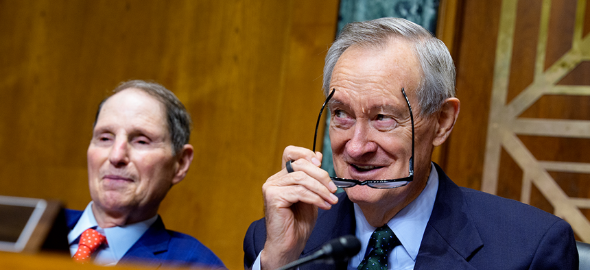 The Senate Finance Committee, led by chairman Mike Crapo, R-Idaho, (right) and ranking member Ron Wyden, D-Ore., advanced the Taxpayer Assistance and Service Act which would require the agency to post key performance metrics online and accelerate its shift away from paper processing.